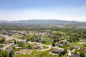 Aerial perspective of suburban area featuring a mountain backdrop