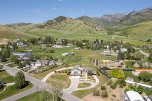 Aerial perspective of suburban area with a mountain backdrop