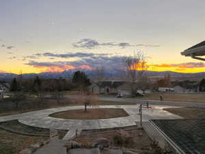 Yard at dusk featuring a mountain view