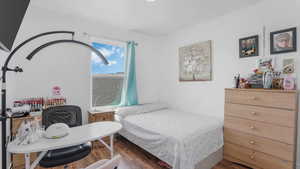 Bedroom with wood finished floors