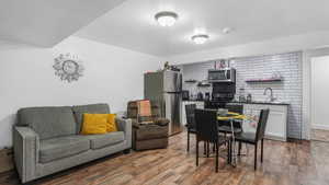 Dining space with wood finished floors