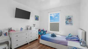 Bedroom featuring dark wood finished floors