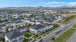 Aerial perspective of suburban area featuring a mountain backdrop