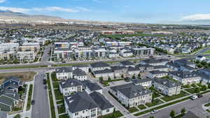 Aerial view of residential area featuring a mountain backdrop