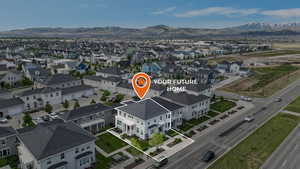 Aerial view of residential area with a mountain backdrop