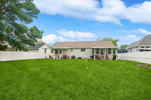 Rear view of house with a patio