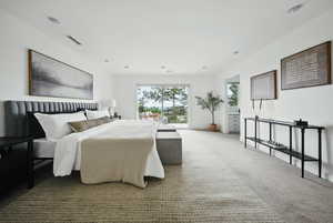 Bedroom featuring carpet and access to exterior