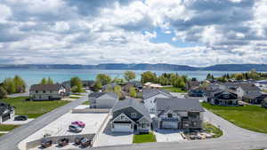 Aerial perspective of suburban area with a water and mountain view
