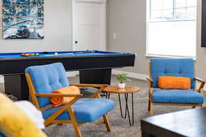 Rec room featuring pool table, carpet flooring, and baseboards