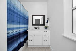 Master Full bath with vanity and a shower with shower curtain