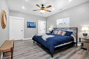 Master Bedroom with baseboards, light wood finished floors, recessed lighting, and a ceiling fan