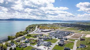 Aerial perspective of suburban area featuring a water and mountain view
