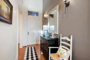 Bathroom with wood finished floors and baseboards