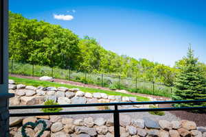 View of yard featuring a balcony