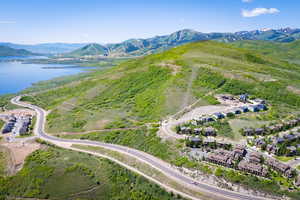 View of property location featuring a water and mountain view