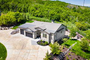 View from above of property featuring a forest