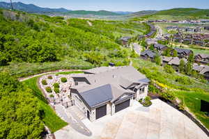 View from above of property with a mountain backdrop