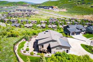 Aerial perspective of suburban area featuring a mountain backdrop