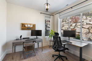 Office area featuring wood finished floors and baseboards