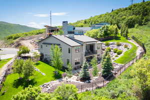 Rear view of property with a balcony