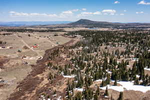 Aerial overview of property's location with a mountainous background