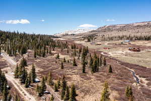 View of mountain backdrop featuring rural landscape