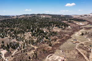 Aerial overview of property's location with a mountain backdrop