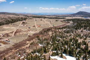 Aerial overview of property's location with a mountainous background