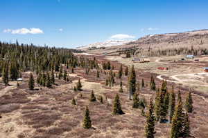 View of mountain backdrop with rural landscape