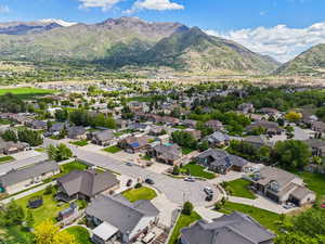 Aerial view of residential area featuring a mountain backdrop