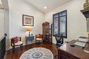 Office space with hardwood / wood-style floors, lofted ceiling, and recessed lighting