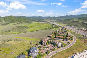 Aerial overview of property's location featuring a mountain backdrop