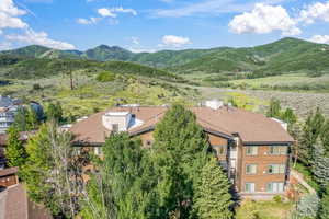 View of subject property featuring a mountainous background