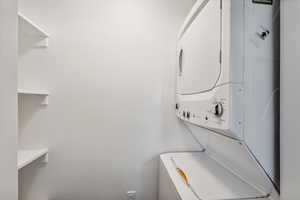 Washroom featuring estacked washer and dryer