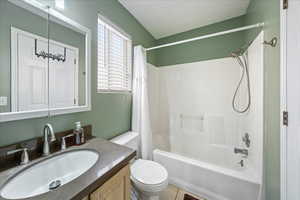 Enjoy an updated second bathroom featuring a shower and bathtub.