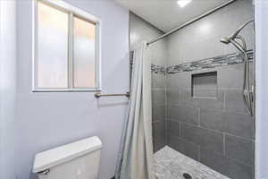 Master shower. Completely redone. Beautiful tile with inset for the necessities and new lighting.