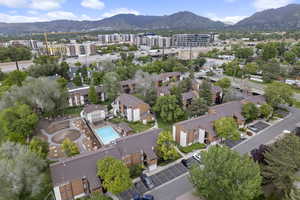 Aerial view of a mountain backdrop and a pool
