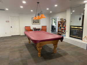 Playroom featuring recessed lighting, carpet, a premium fireplace, billiards table, and baseboards