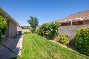 View of yard featuring cooling unit and a patio