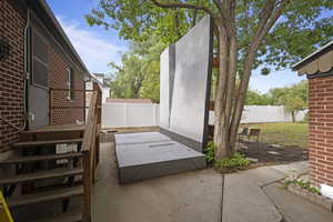 Fenced backyard featuring a patio