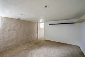 Below grade area featuring carpet flooring