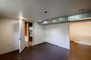 Finished below grade area featuring recessed lighting and baseboards
