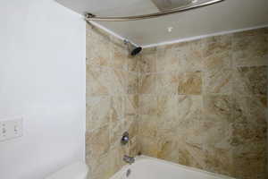 Bathroom with shower / tub combination