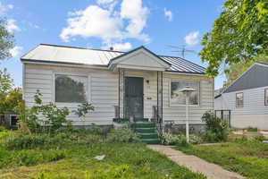 View of front of home featuring a standing seam roof and metal roof
