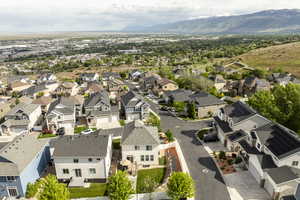 Aerial perspective of suburban area with a mountainous background