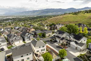 Aerial perspective of suburban area with a mountain backdrop
