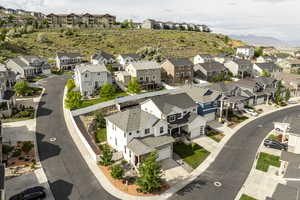 Aerial view of residential area featuring a mountain backdrop