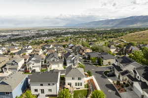 Aerial perspective of suburban area with a mountainous background