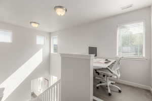 Office area featuring baseboards