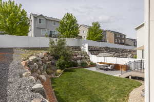 View of yard featuring a residential view, a patio, and an outdoor hangout area